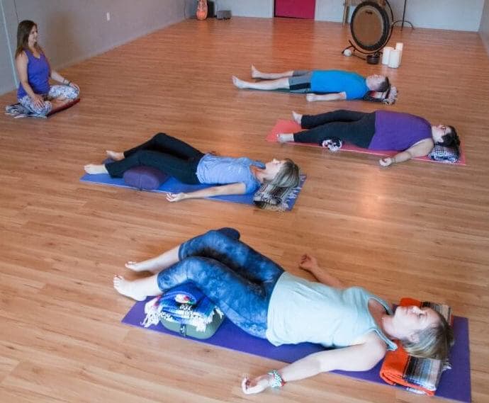 yoga teacher with students