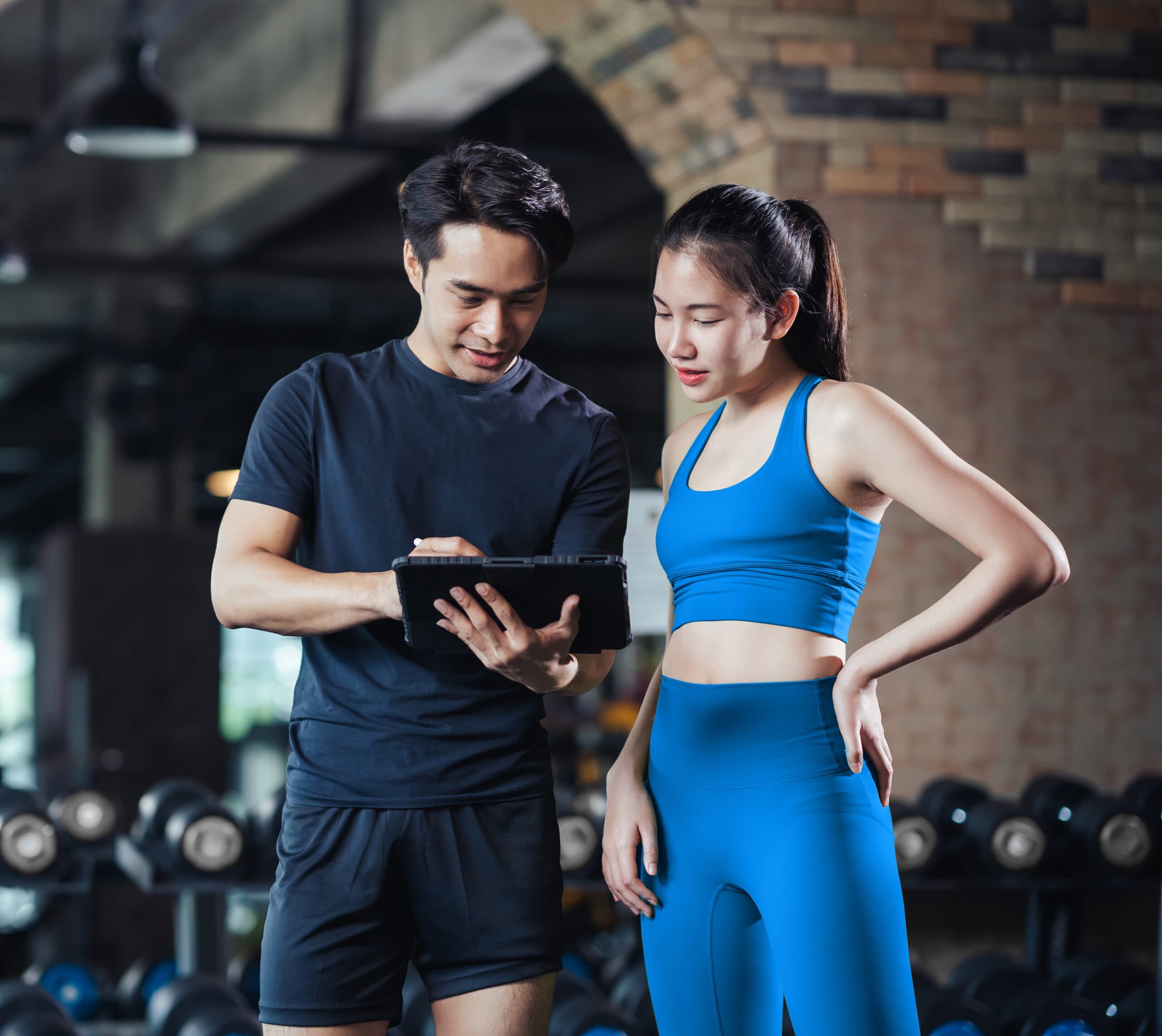 Multi-location gym owner reviewing business performance across multiple facilities
